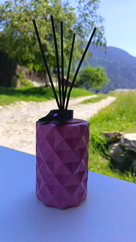 Diffuseur rose avec bâtons